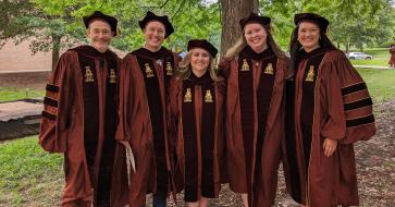 grads in a photo
