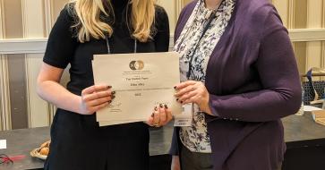 an award being collected by two people