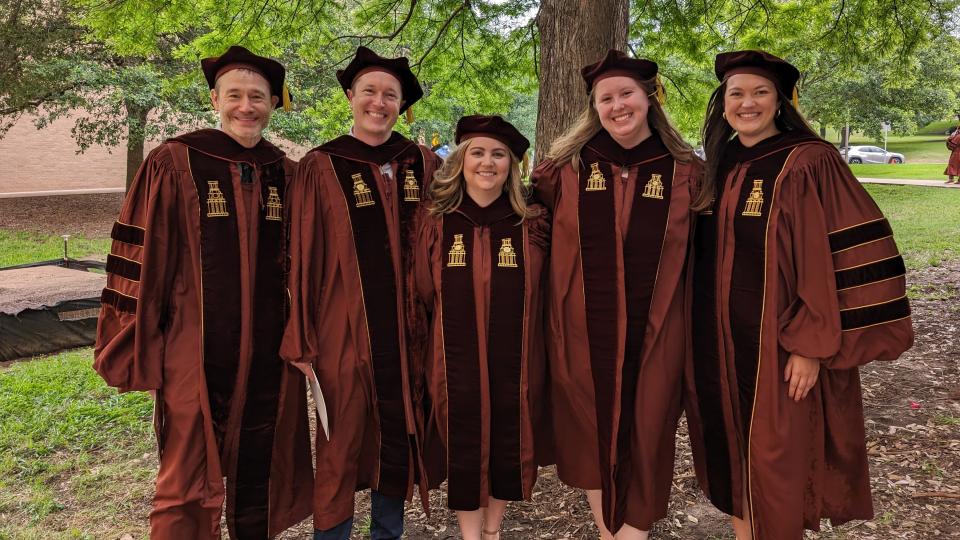 grads in a photo