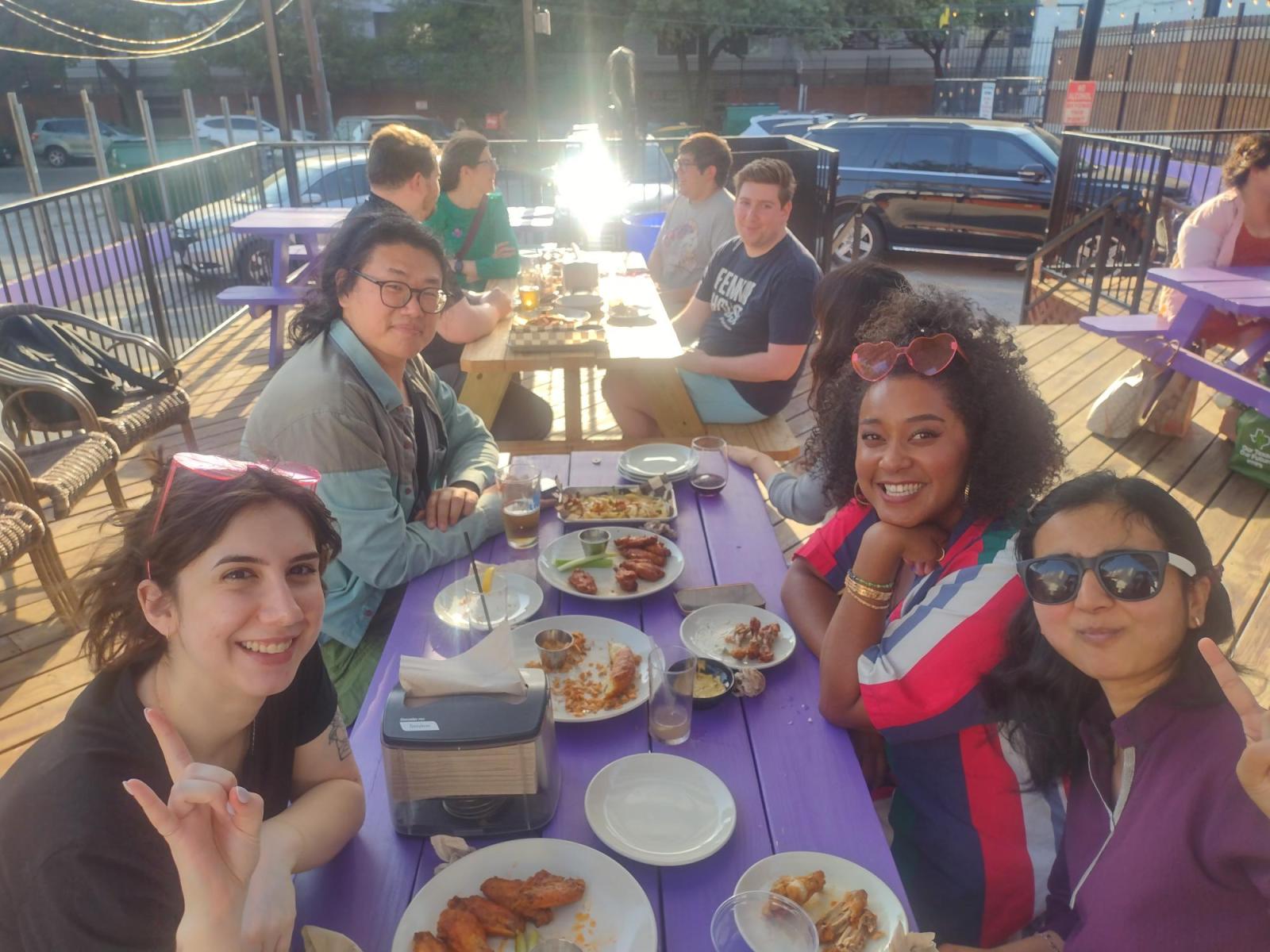 CMS Grads give Hook 'Em Horns