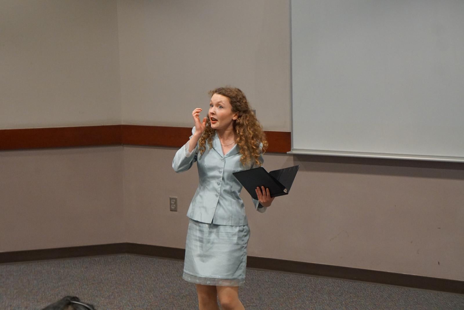 Student performing dramatic interpretation.